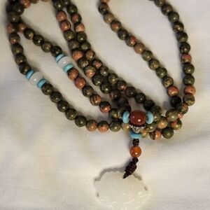 Elegant Beaded Necklace with Jade Pendant